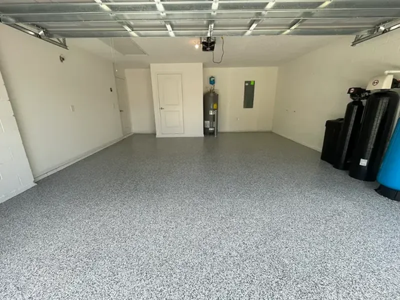 Grey flake epoxy garage floor by DJ Epoxy Solutions